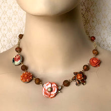 Load image into Gallery viewer, mannequin wearing a necklace made from repurposed earrings and pressed glass beads
