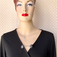 Load image into Gallery viewer, mannequin in a black wrap dress with a black and rhinestone set sweater guard
