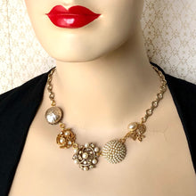 Load image into Gallery viewer, mannequin wearing necklace made with five vintage champagne pearl earrings and vintage chain

