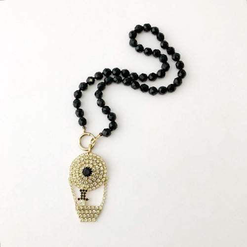  necklace with vintage rhinestone hot air balloon pendant on a white background