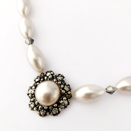 close-up of vintage focal and pearl bead necklace