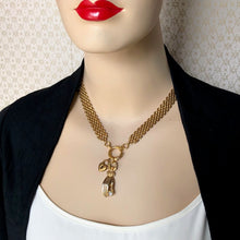 Load image into Gallery viewer, mannequin wearing a vintage brick chain necklace with front ring closure decorated with a lady&#39;s hand and heart shaped padlock charm
