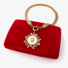 Load image into Gallery viewer, necklace made with vintage Maltese cross pendant, chain and clasp displayed on a red velvet jewellery boxon 
