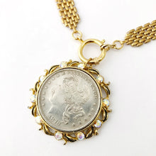 Load image into Gallery viewer, close up of replica American silver dollar in vintage brooch setting
