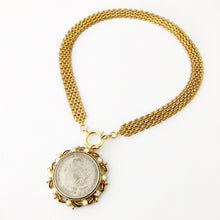 Load image into Gallery viewer, front opening necklace with replica American silver dollar in vintage brooch setting with vintage brick chain flat on a white background
