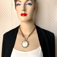 Load image into Gallery viewer, mannequin wearing a front opening necklace with replica American silver dollar in vintage brooch setting with vintage brick chain 

