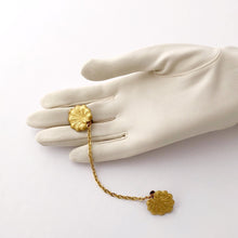 Load image into Gallery viewer, sweater clip of vintage lily pads displayed on a gloved hand
