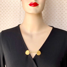 Load image into Gallery viewer, mannequin in a black wrap dress with a sweater clip of lily pads holding the front closed
