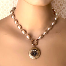 Load image into Gallery viewer, mannequin wearing a pearl bead necklace with vintage locket suspended from the front

