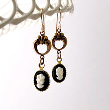 Load image into Gallery viewer, earrings made with vintage black and white cameos hanging from a white lace wire frame
