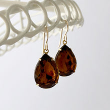 Load image into Gallery viewer, pear shaped smoky topaz rhinestone earrings hanging from a white frame
